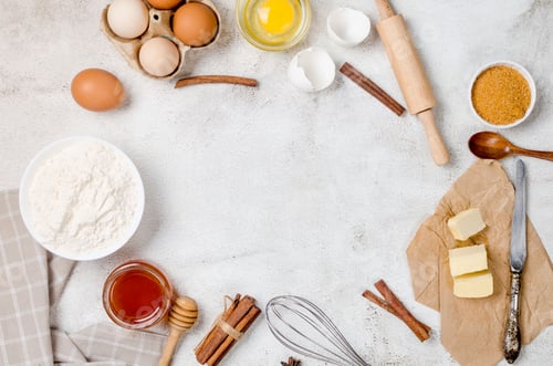 Preview: Ingredients for making dough dishes: cakes, cookies, muffins, pies on a gray background.