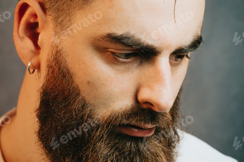 Preview: Portrait of a Young bearded hipster man, mental health and depression