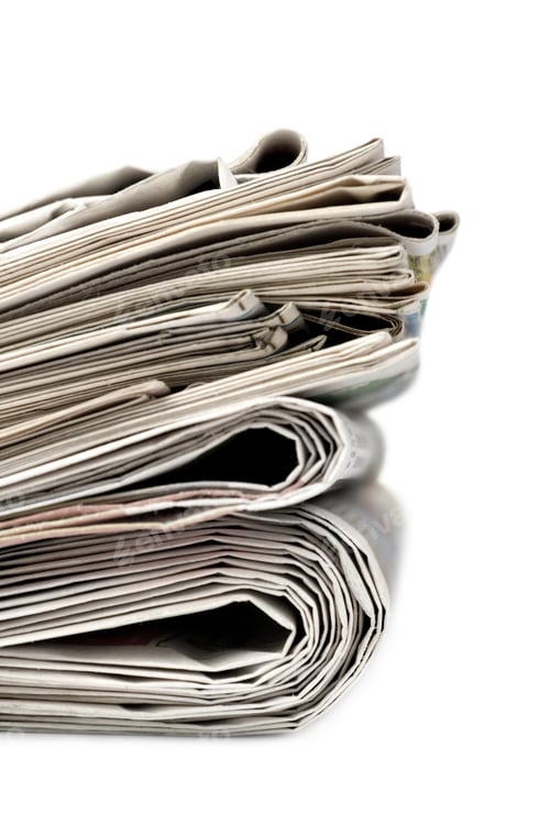 Preview: A stack of newspapers.