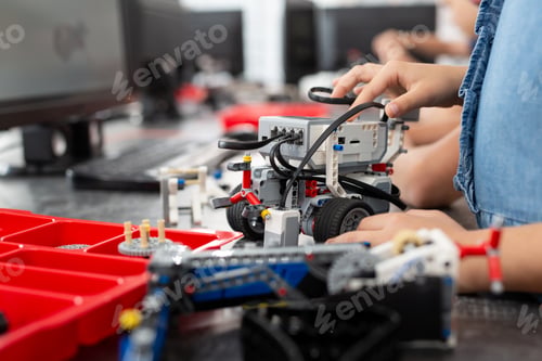 Preview: Children play with a robot in a robotics class