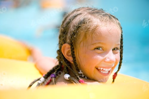 Preview: Little girl sitting on inflatable ring
