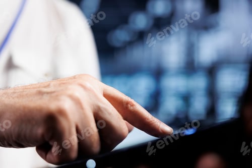Preview: Business executive examining servers