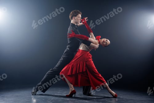 Preview: Dance Couple Performing Dramatic Partner Pose in Studio Lighting