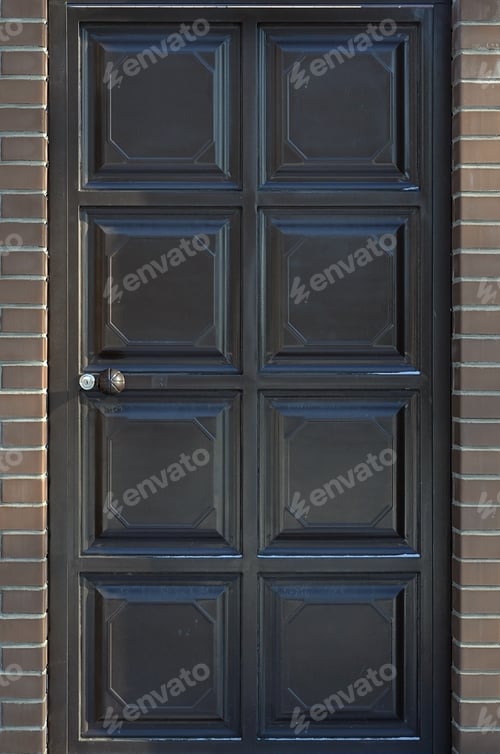 Preview: The texture of a painted metal door from a brick fence