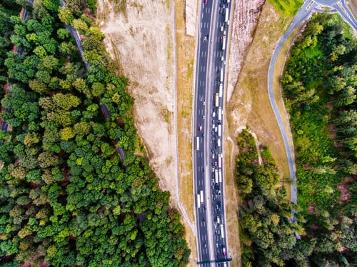Preview: Aerial view of highway, traffic jam, green forest, Netherlands