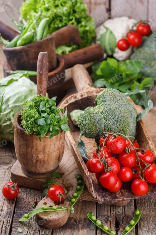 Preview: Variety of vegetables in vintage wooden ware.