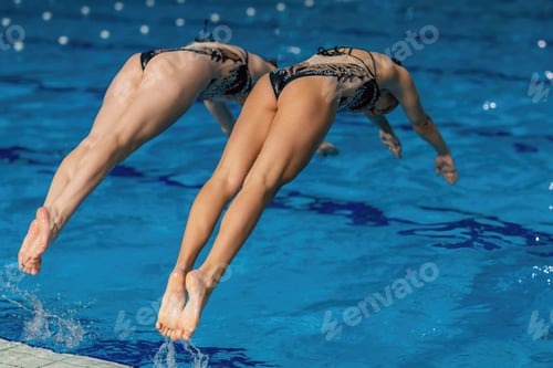 Preview: Synchronized grace, the duo executes a stunning mid-air jump into the pool, showcasing skill