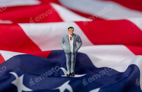 Preview: miniature figure of a male politician on USA flag