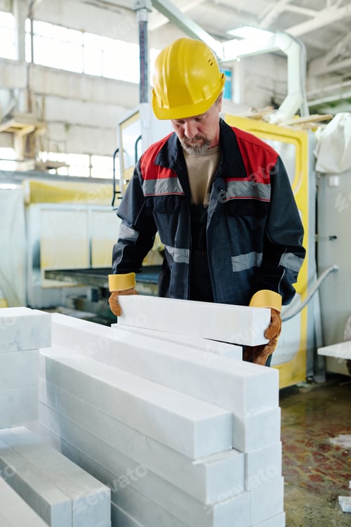 Preview: Worker putting stones in stack for production