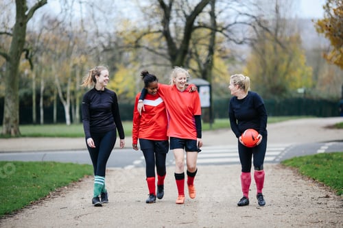 Preview: Female soccer players en route to play soccer in park