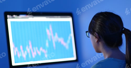 Preview: Woman study on the stock market data in office