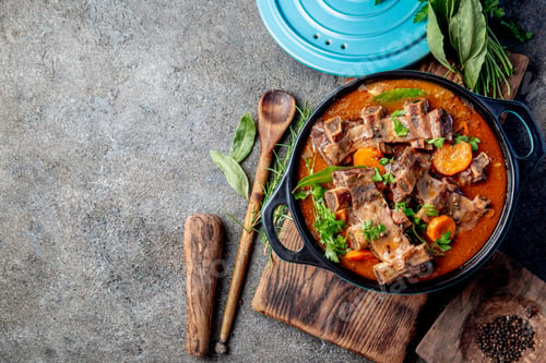 Preview: Beef ribs Bourguignon. Beef ribs stewed with carrot, onion in red wine. France dish. Top view