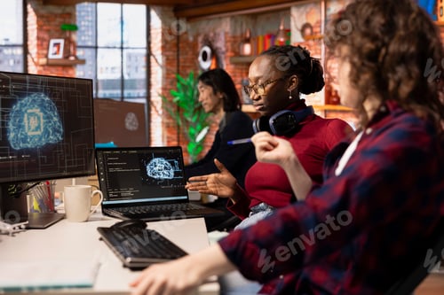 Preview: Teamworking startup technicians cooperating in AI industry company