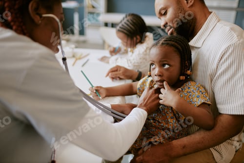 Preview: Child Holding Fathers Hand While Doctor Examining