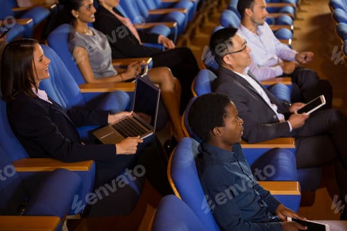 Preview: Business executives listening to speech