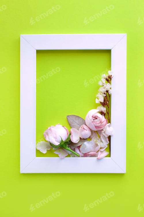 Preview: Beautiful bouquet, delicate roses and petals, white frame on a green background. Flower arrangement