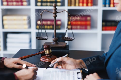 Preview: Lawyer working with client discussing contract papers with brass scale about legal legislation.