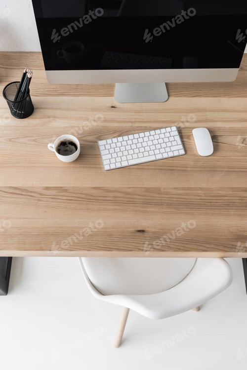 Preview: top view workplace with computer with wireless mouse and keyboard in modern office
