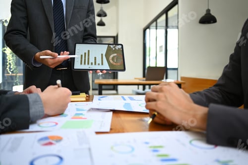 Preview: Shot of male business team leader presenting sales report, marketing strategy at meeting.
