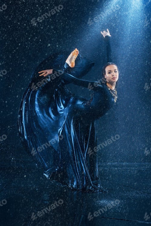 Preview: The young beautiful modern dancer dancing under water drops