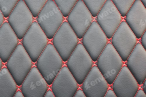 Preview: Background of black leather car seat upholstery with rhombus pattern and red stitch lines