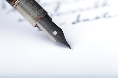 Preview: Fountain pen writes on paper with ink during a quiet writing session