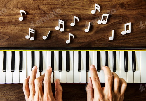 Preview: Hand playing piano on wooden table