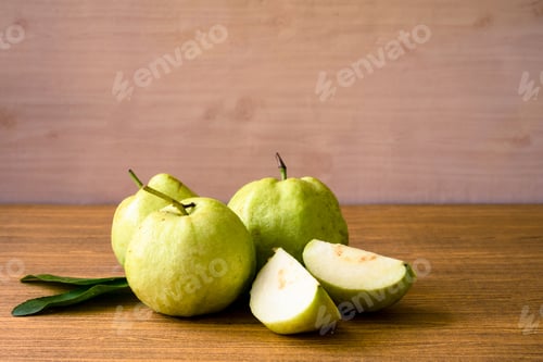 Preview: Fresh guava fruit on wooden table background.