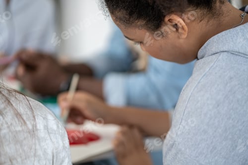 Preview: Girl attend and join to the arts class and using paintbrush drawing and painting artwork.