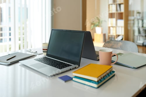 Preview: Opened Laptop and Notebooks on Desk
