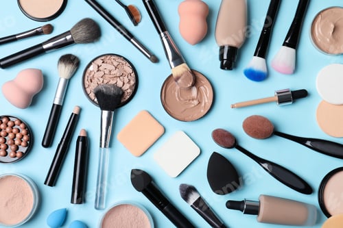 Preview: Flat lay composition with skin foundation, powder and beauty accessories on color background