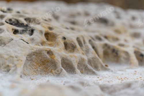 Preview: Barren desert landscape situated on the edge of a steep cliff, shrouded in a dense layer of fog
