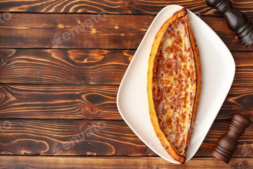 Preview: Pide - Turkish baked bread on wooden table