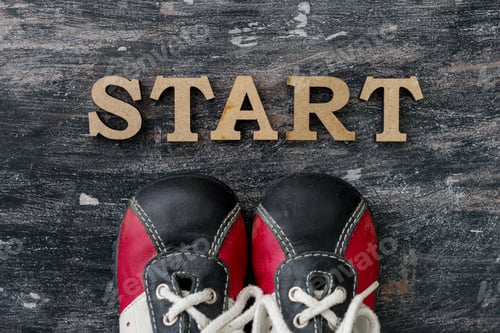 Preview: Sneakers before the word start. Dark background