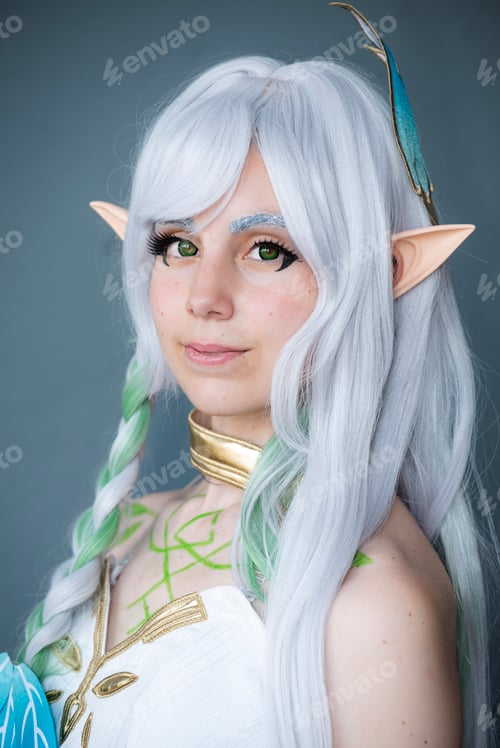 Preview: Caucasian female cosplayer dressed as an anime character in a white dress