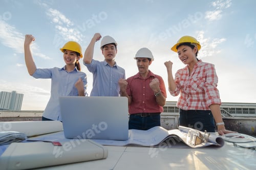 Preview: Happy professional construction engineers working in congratulation action after completed