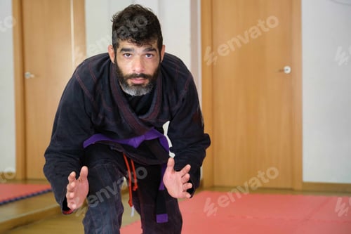 Preview: Brazilian Jiu-Jitsu teacher at the Academy looking at camera.