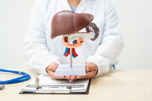 Preview: A female doctor works at a desk in hospital, discussing liver diseases like hepatitis B,cirrhosis