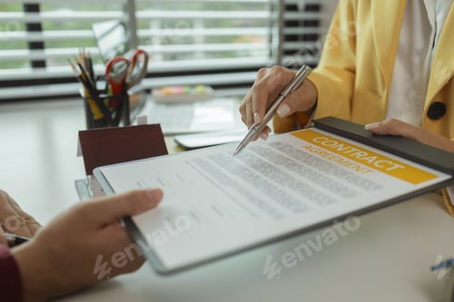 Preview: A man signs a contract after agreeing to buy a house with an agent. The agent explains the details o