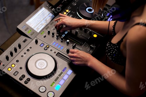 Preview: Female disc jockey mixing tracks
