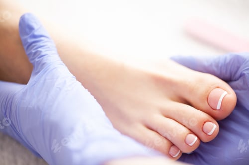 Preview: Pedicure Day. Pedicure Specialist Works With the Patient in Spa Salon