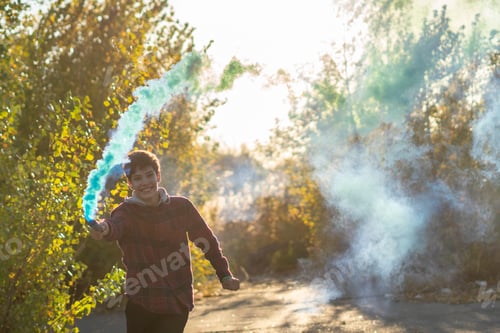 Preview: young man have fun with smoke fire cracker f