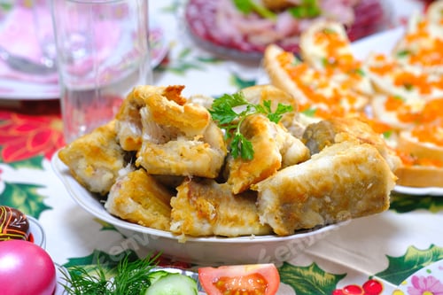 Preview: Ukrainian Easter festive dishes. Festive table setting. Bright colored eggs, cake Paska