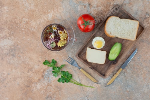 Preview: Delicious chamomile tea with tomato and bread