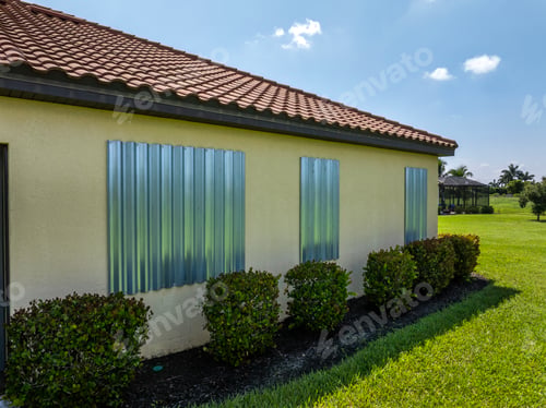 Preview: Hurricane shutters on Florida house windows.