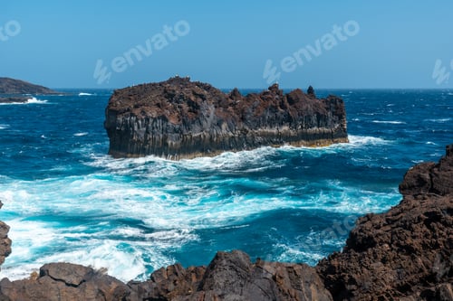 Preview: Roque de Las Gaviotas seen from the volcanic trail in the village of Tamaduste of El Hierro
