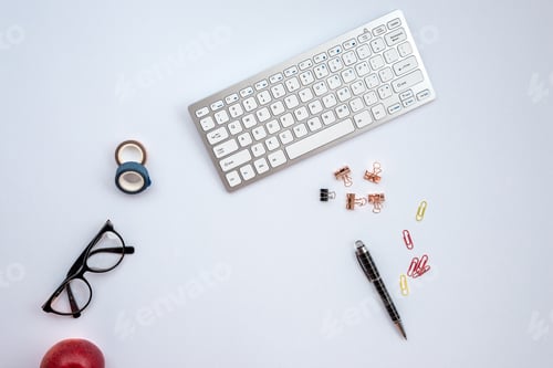 Preview: White desk with a
stationery and other objects on it