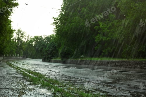 Preview: View of heavy pouring rain on city street