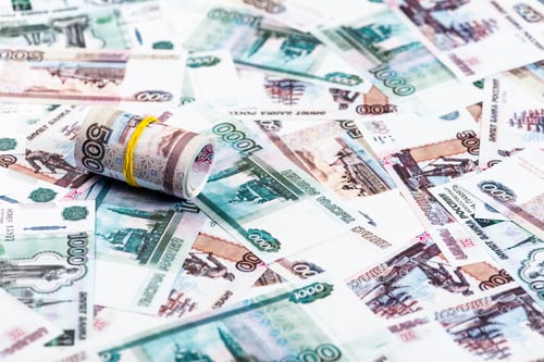 Preview: selective focus of cash roll on russian banknotes