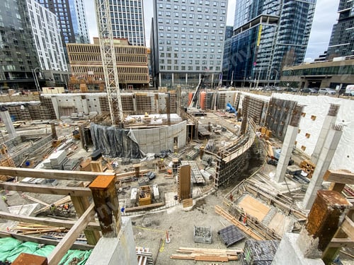 Preview: Construction site surrounded by downtown buildings.